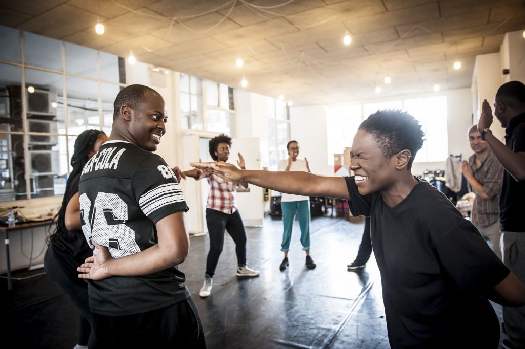 This image of the TALWA theatre company, which champions black excellence in theatre, showing the work in rehearsals of a group of black actors .